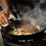 Chef cooking a delicious steak dish at Oxford Casino Hotel in Oxford, Maine