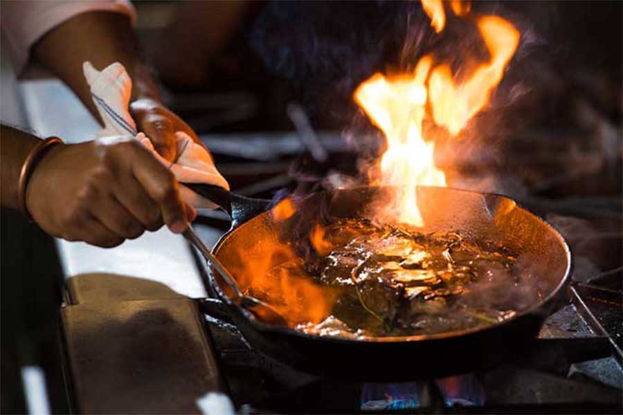 Steak cooked on a flaming skillet at Oxford Casino Hotel in Maine